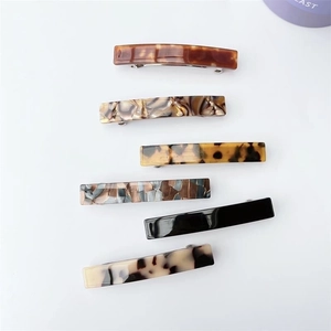 Set of six rectangular acetate spring hair clips in tortoiseshell and marble patterns