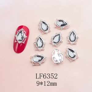 Detail of 9x12mm teardrop nail charms with silver alloy base and dark grey rhinestone