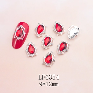 Detailed 9x12mm teardrop ruby nail charm with intricate silver vintage lace edge design
