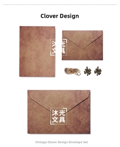 Detail view of retro kraft paper envelopes with jute rope and bronze clover charms