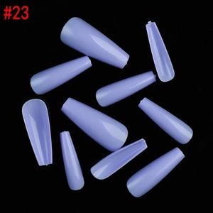 Macro detail of long coffin shaped light purple glossy press on nails on black background