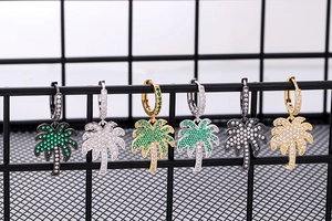 Detail of palm tree earrings with colorful crystals in gold, silver, and gunmetal finish