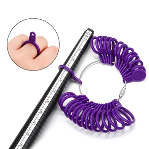 Ring sizer tool set with purple plastic finger gauges and black US size measuring mandrel