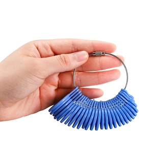 Close-up of blue plastic ring sizers on a steel wire loop for measuring finger sizes