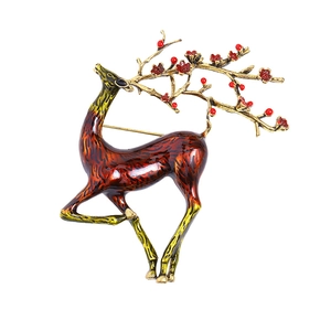 Elegant enamel elk brooch with golden antlers and red plum blossoms on white background