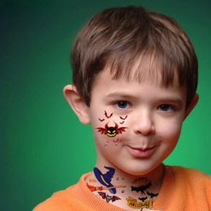 Detail view of Halloween temporary tattoos featuring bats, pumpkins and witch hats designs
