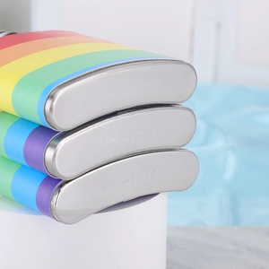 Detail shot of rainbow stainless steel hip flasks showing 6oz 7oz and 8oz bottom markings