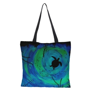 Detail of 3D sea turtle print on waterproof linen tote bag with black strap handles