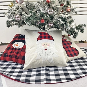 Christmas red and black buffalo plaid pillow covers with matching tree skirt and Santa motif