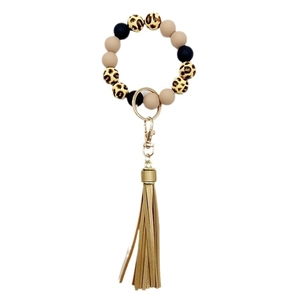 Beaded wristlet keychain with leopard print beads, golden ring, and beige leather tassel