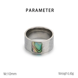 Close-up of hammered stainless steel ring with colorful abalone shell inlay detail