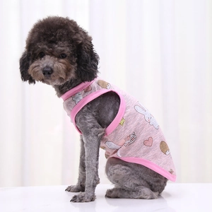 Close-up of pink pet vest with cartoon bunny and ice cream prints on a small dog