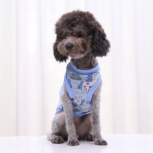 Detail of light blue knitted pet vest featuring a cute little unicorn graphic print