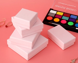 Various sizes of minimalist pink paper jewelry boxes for rings and necklaces