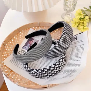 Three elegant houndstooth patterned wide headbands in classic retro French fabric style