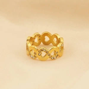 Detailed view of gold-plated hollow heart ring with sparkling crystal stone settings
