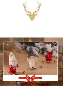 Close-up of three knitted Christmas ski dolls in red white and grey with wooden skis