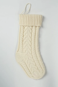 Detail of 18 inch cream white knit Christmas stocking with classic cable stitch patterns