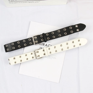 Detail of black and white punk star eyelet belts with double-pin metal buckles