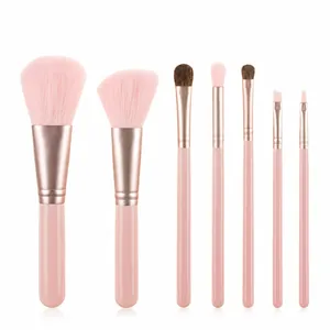 Close-up of 7-piece pink makeup brush set with rose gold ferrules and fiber bristles