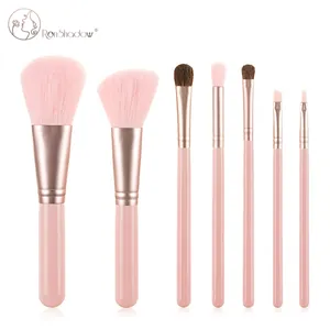 Close-up of 7-piece pink makeup brush set with rose gold ferrules and fiber bristles