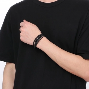 Men's multilayer black braided leather bracelet with magnetic clasp on wrist