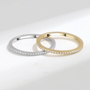 Macro shot of silver and gold S925 sterling silver rings with exquisite paved diamonds