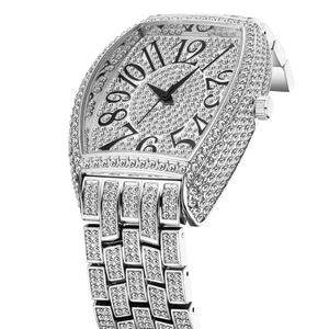 Macro side view of silver tonneau iced-out watch with crystal-paved dial and big numerals