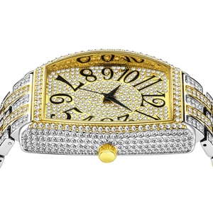 Detail of tonneau-shaped luxury iced-out watch with Arabic numerals and gold silver band