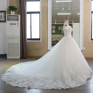 Elegant white off-shoulder lace wedding gown with long cathedral train and floral embroidery