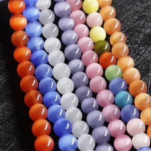 Macro detail of colorful cat eye stone beads for DIY jewelry making and handmade crafts
