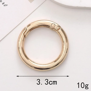 Close-up of golden metal spring o-ring snap hook 3.3cm size and 10g weight details