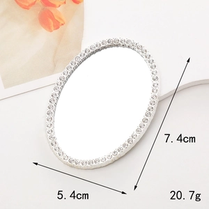 Silver oval rhinestone mirror accessory for DIY phone cases, dimensions 7.4cm by 5.4cm