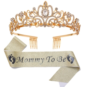 Close-up of golden Mommy To Be sash with black lettering and sparkling rhinestone tiara set