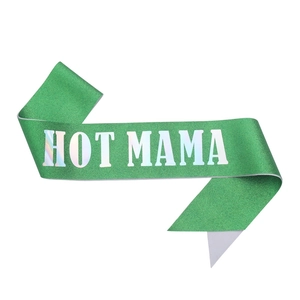 Close-up of a bright green glitter sash with holographic HOT MAMA text for party