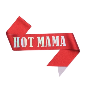 Close-up of red glitter fabric sash featuring holographic HOT MAMA lettering for parties