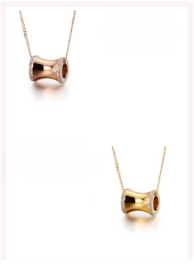 Detail of cylinder pendants in rose gold and gold plating with zircon stones