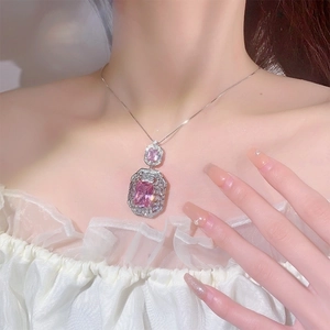 Elegant silver necklace with cascading pink rectangular gemstones and pavé diamonds