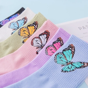 Close-up of pastel cotton socks set with butterfly embroidery in six assorted colors