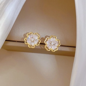 Titanium steel hollow flower earrings with gold plating and white zircon inlay for women