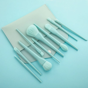 Detailed view of 10 mint green makeup brushes set with a matching leather storage bag