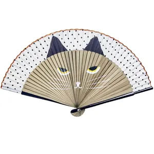 Close-up of Japanese style folding fan featuring a cat face design and bamboo ribs