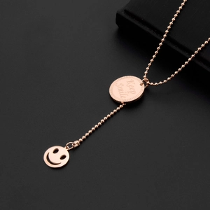 Rose gold stainless steel necklace with Keep Smile coin and smiley face charms
