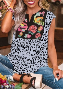 Close-up of leopard print patchwork t-shirt featuring colorful floral patterns and V-neckline