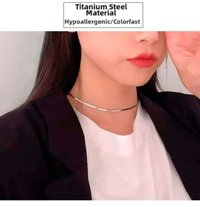 Close-up of a rose gold snake bone choker necklace made of polished titanium steel