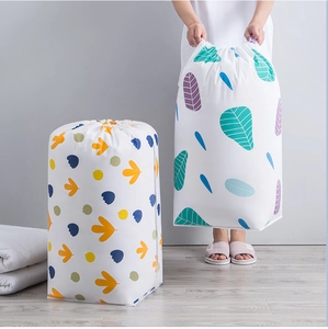 Detail of waterproof PEVA quilt storage bag with drawstring and colorful leaf pattern