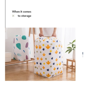Detailed view of large cylindrical storage bag with leaf patterns and drawstring closure
