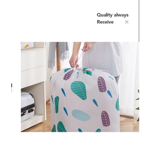 Detail of waterproof PEVA quilt storage bag with leaf pattern and drawstring closure