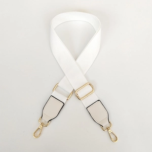 Adjustable white canvas bag strap with elegant gold metal hooks for cross-body bags