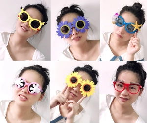 Collage of funny plastic party sunglasses featuring daisy, flower and cartoon character shapes
